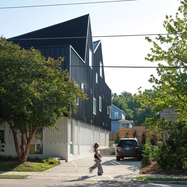Person walking by house
