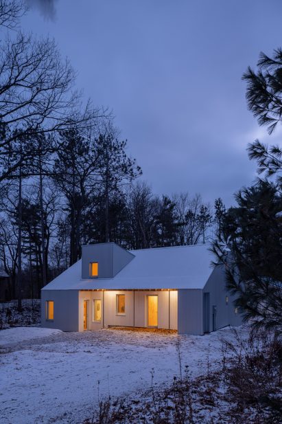 White cabin with snow on it
