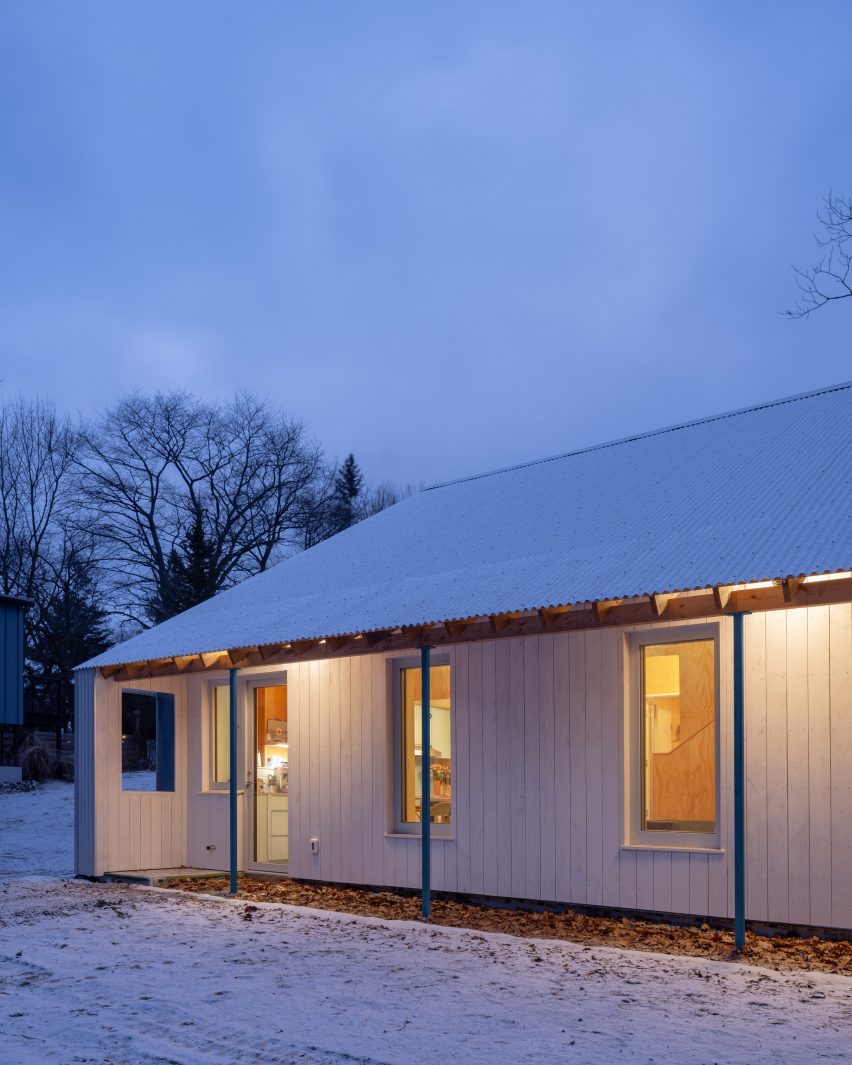 White cabin with snow on it