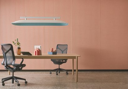Table underneath suspended acoustic panel
