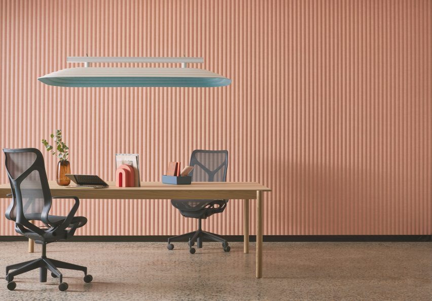 Table underneath suspended acoustic panel