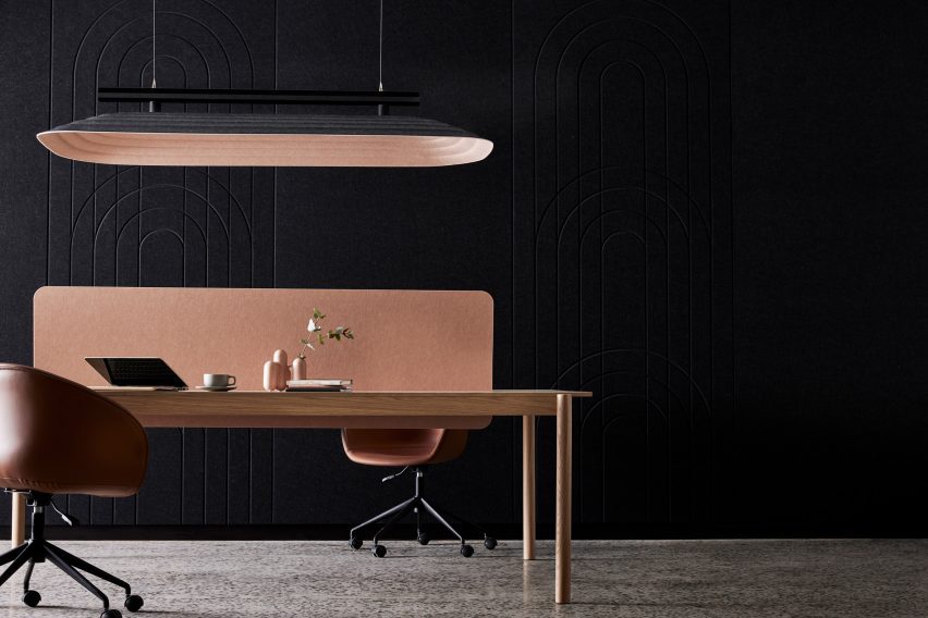 Table underneath suspended acoustic panel