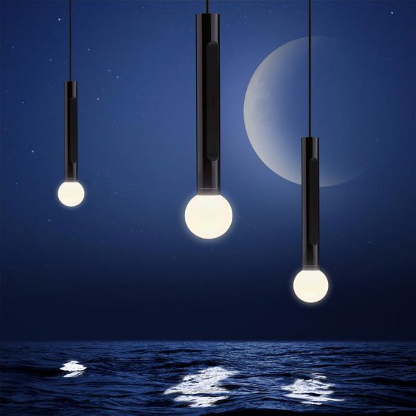 Lights by Occhio against a moon-light dark sky