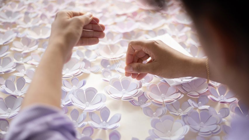 Photo of hands working on textiles