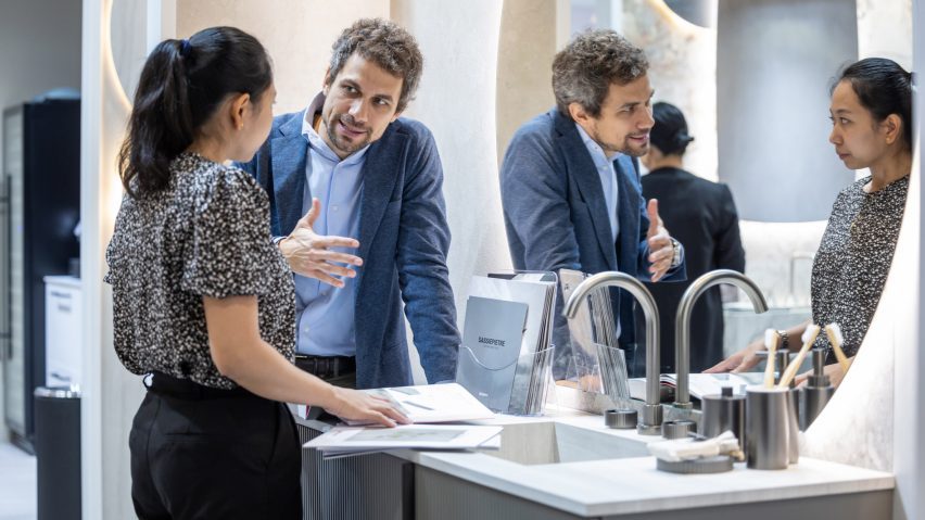 Photo of people talking at trade show