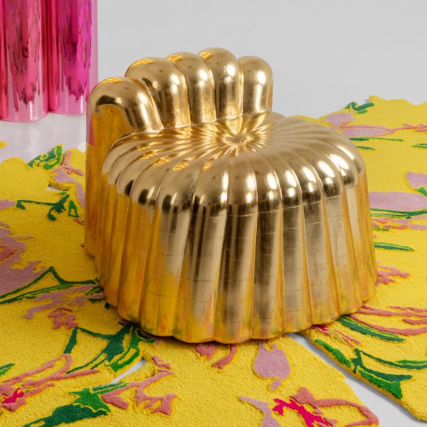 Photo of a gold metal chair by Platalea Studio