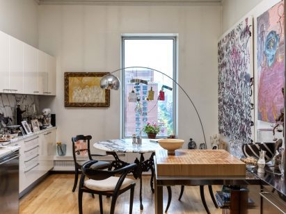 Eclectic mix of furniture and artwork in a kitchen