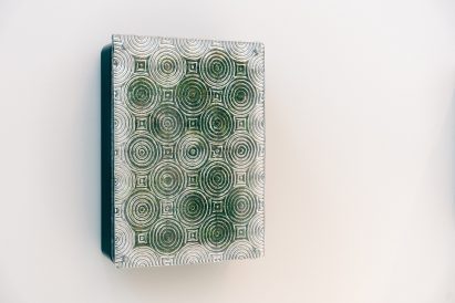 Wall-mounted charging point with plants inside it