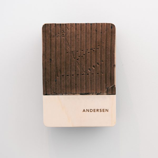 Brown wall-mounted charging point with a ribbed design