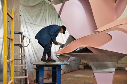 Person working on sculptural piece