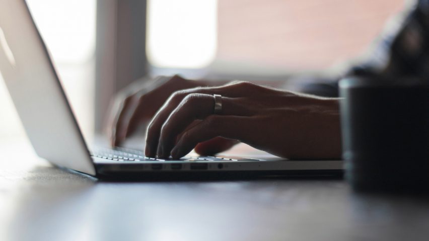 Person typing on laptop