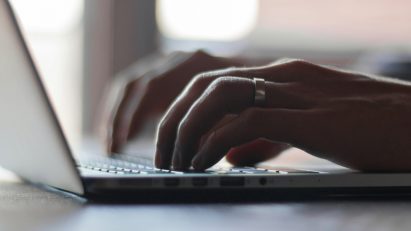 Person typing on laptop