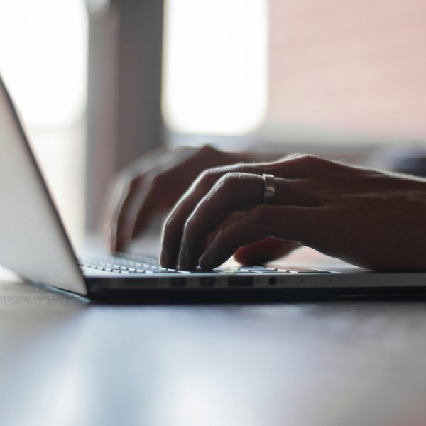 Person typing on laptop