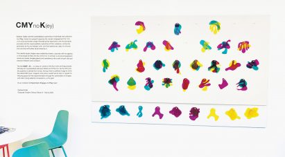 Exhibition image with colourful shapes on wall