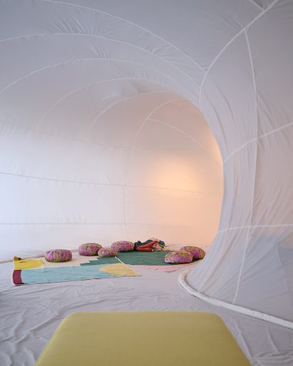 White inflatable with blankets and pillow