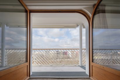 View out of apartment block by Brenac & Gonzalez & Associés