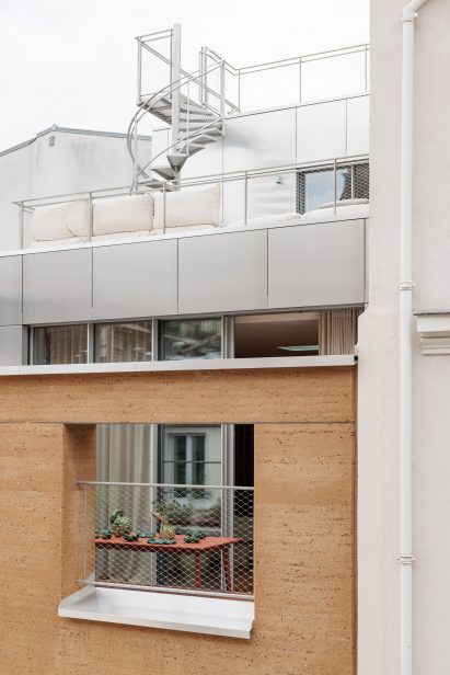 Facade view of rammed-earth townhouse by Déchelette Architecture