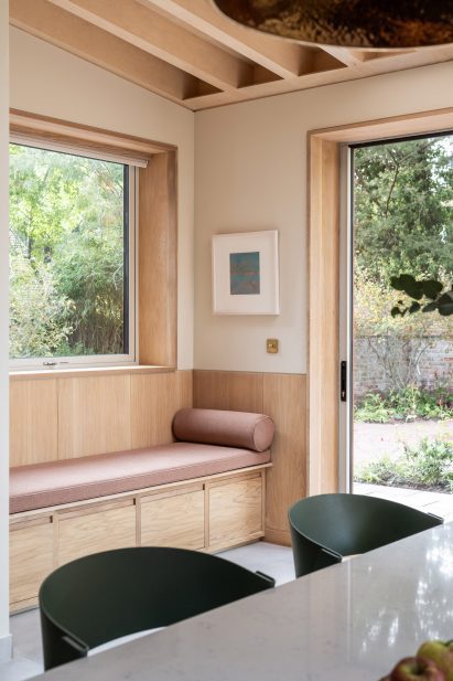 Wood-lined living space with window seat