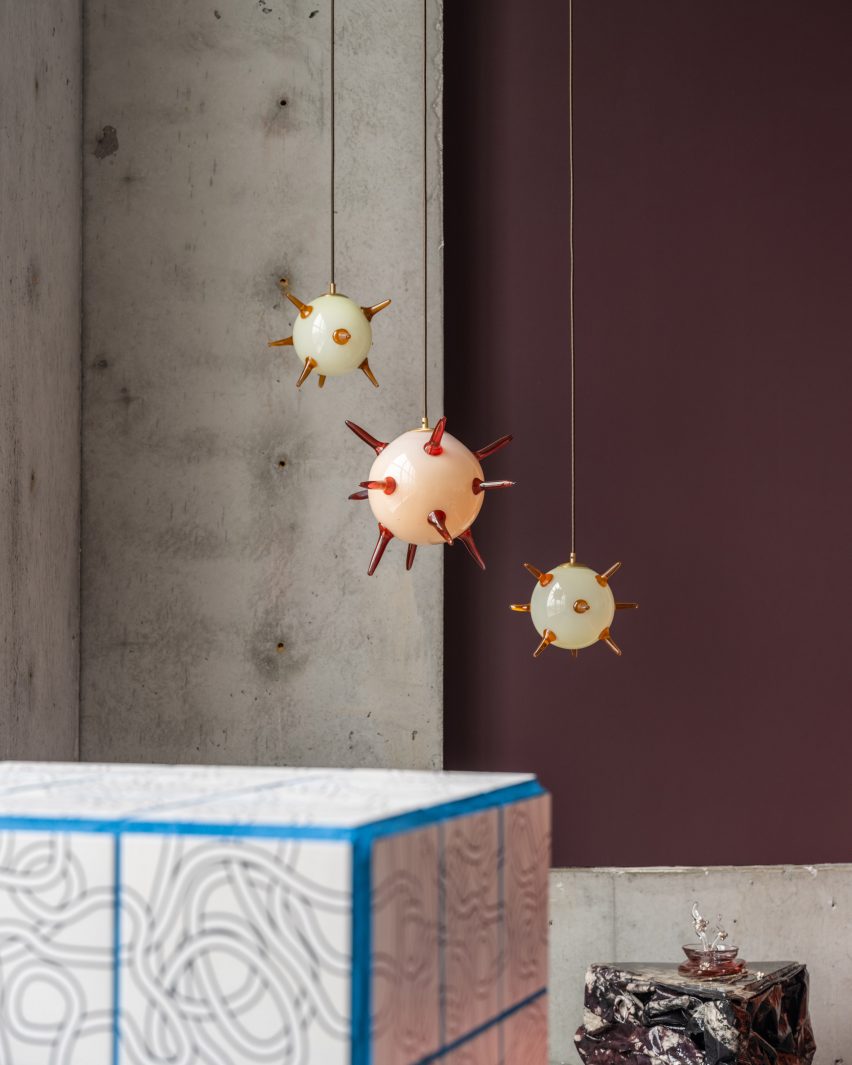 A pedestal and hanging orbs