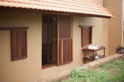 Rammed earth exterior of Di Linh House by k59 Atelier