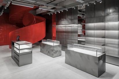 Diesel Miami store interior with metal surfaces and red staircase