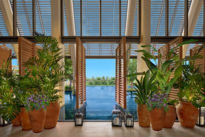 Hotel lobby with pivoting louvred panels