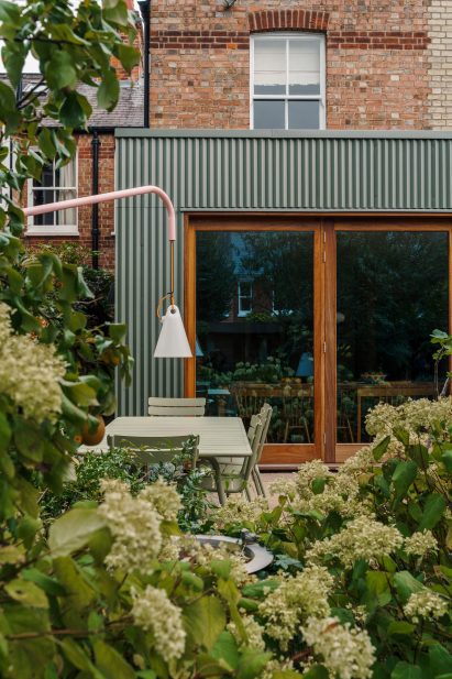 Residential extension with green metal cladding