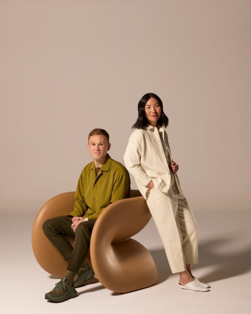 People leaning against chair