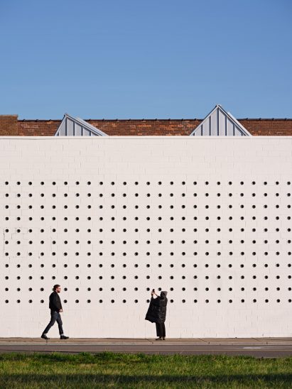 CMU wall punched with small circular windows at Lantern arts centre