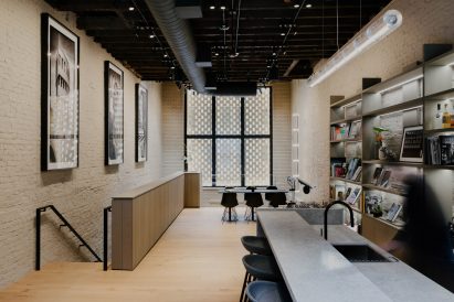 Studio space positioned behind a brickwork lattice