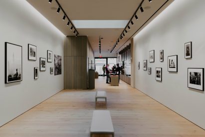 View of retail space with wood panelling and glass vitrines