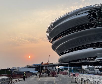Round building against sunset background