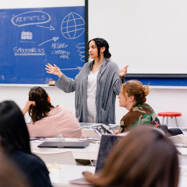 Person standing in front of classroom