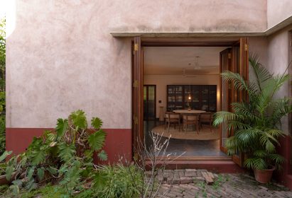 House with exterior of red-brown plaster