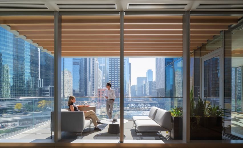 People looking out windows in Chicago
