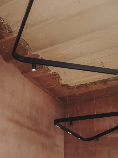Close-up of Catalan vault ceiling and floating luminaires