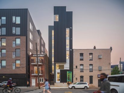 A slim building between two others