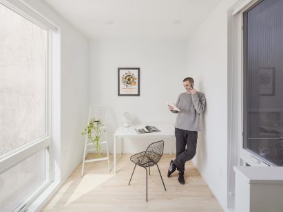 Person standing in white room