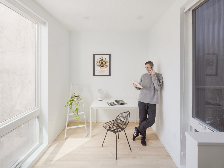 Person standing in white room