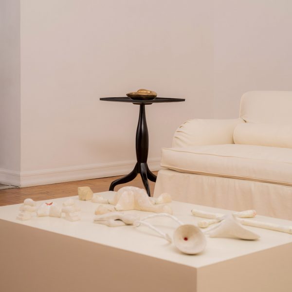 Clay objects on table in front of coucn