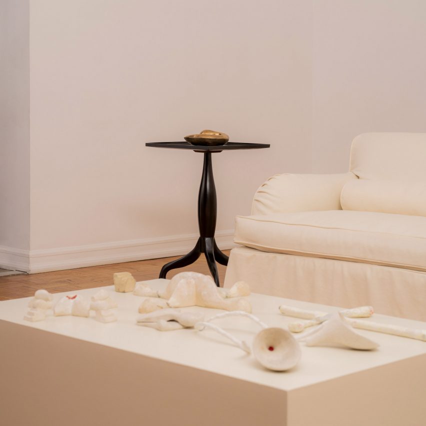Clay objects on table in front of coucn