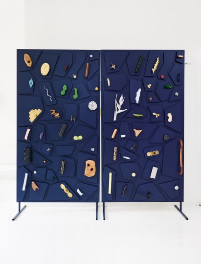 Selection of door handles on a blue cabinet