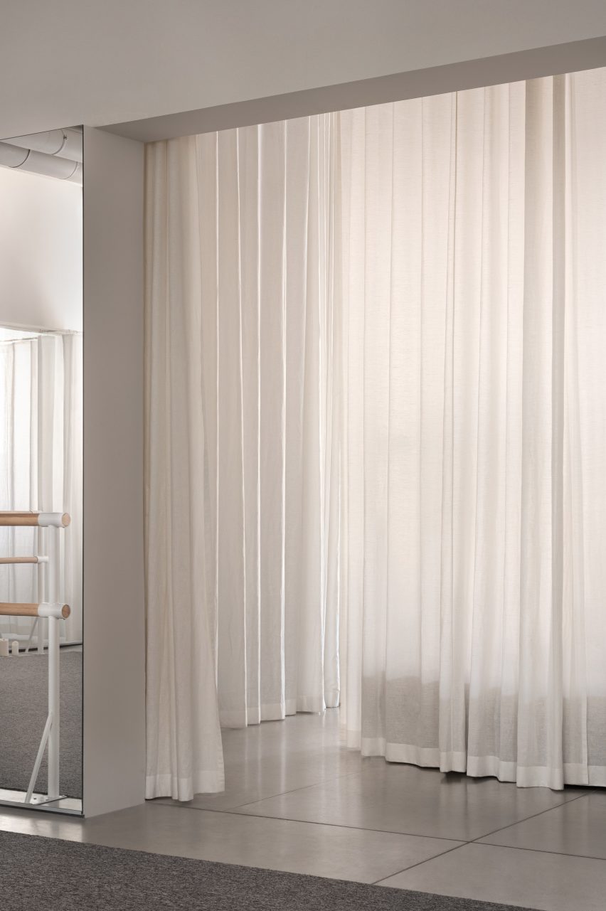 White curtains and ballet barre