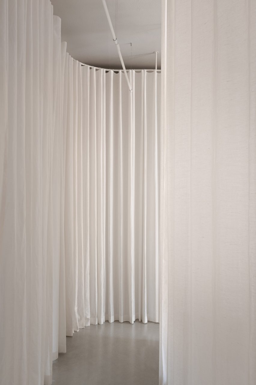 White curtain curving around corner