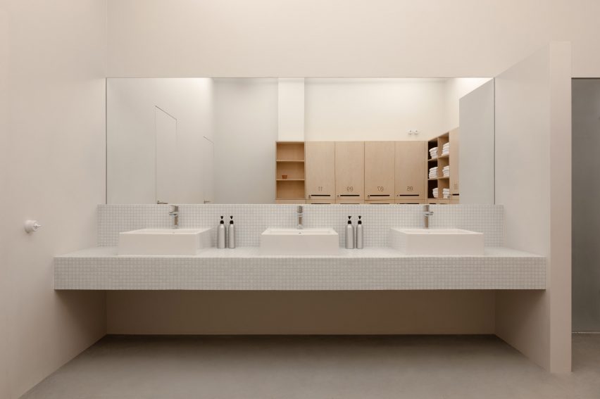 Bathroom with long sink and mirror