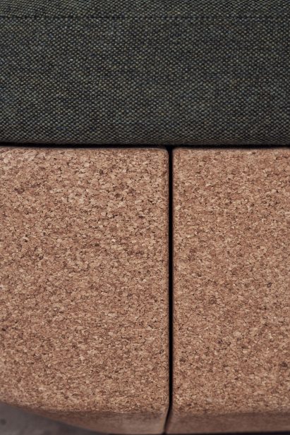 Close-up of green upholstery on cork base