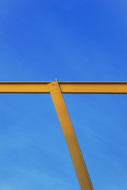 Yellow steel beams repurposed by Piovenefabi for Horst