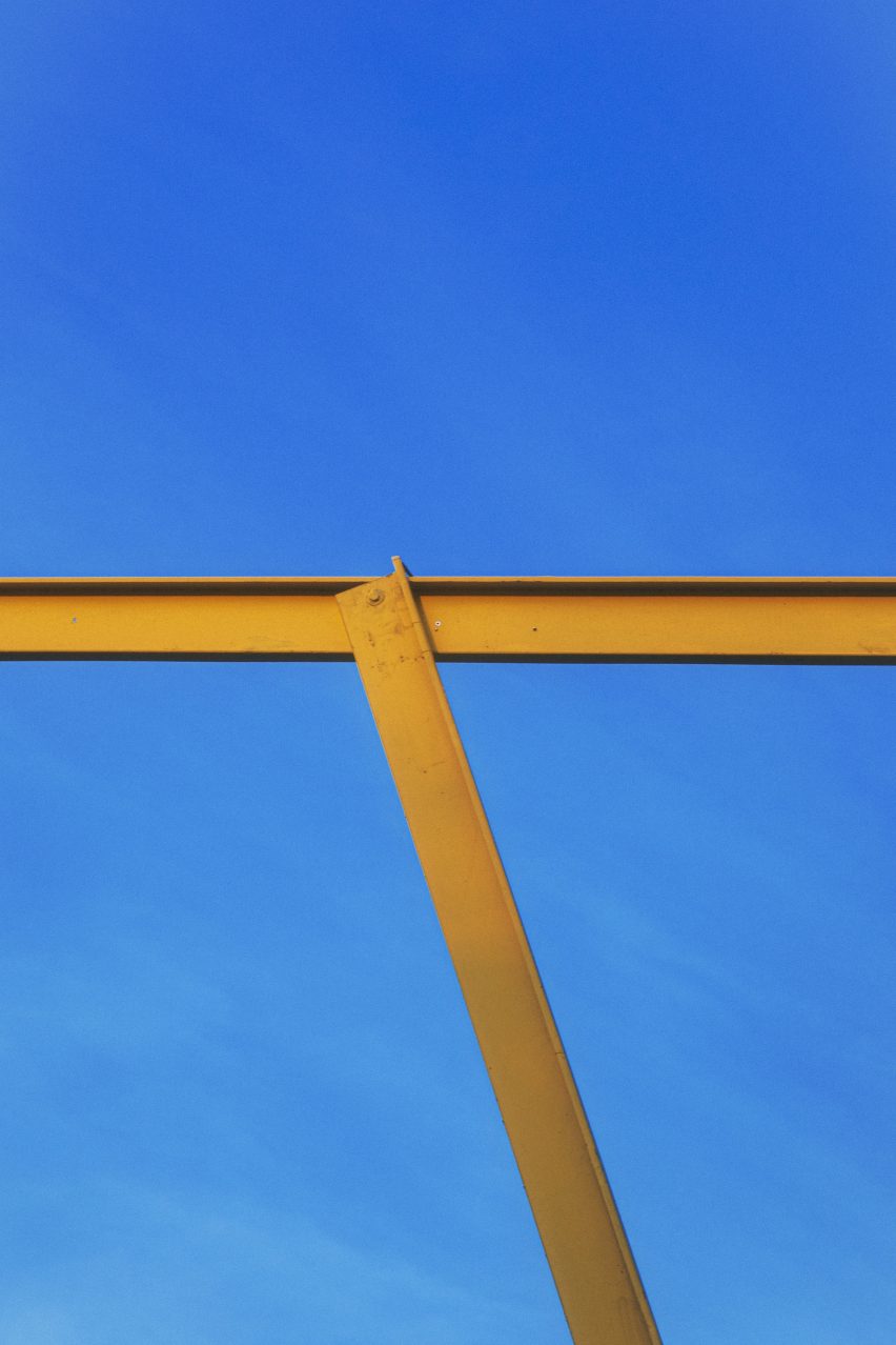 Yellow steel beams repurposed by Piovenefabi for Horst