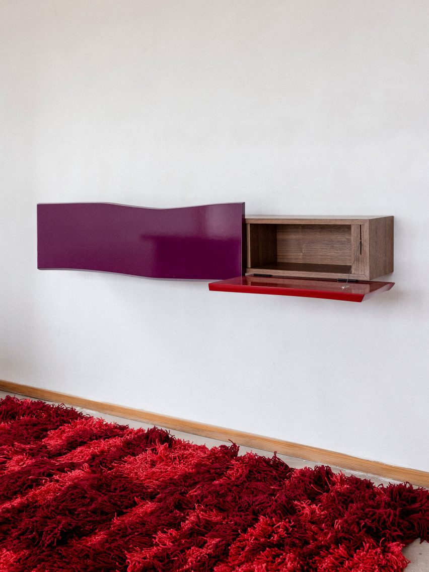 Shelving on wall with red carpet
