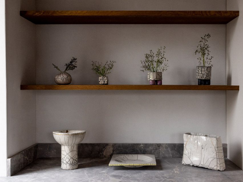 A kitchen with window shelving